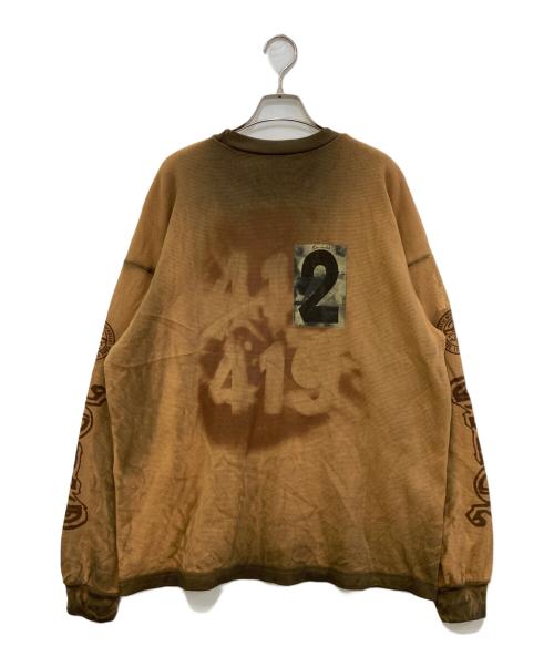 Travis Scott（トラヴィススコット）TRAVIS SCOTT (トラヴィススコット) Coachella プリントカットソー ブラウン サイズ:Lの古着・服飾アイテム