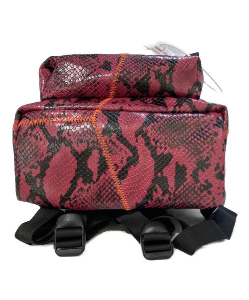 EASTPAK（イーストパック）EASTPAK (イーストパック) KOCHE (コシェ) Orbit Snake Backpack パープルの古着・服飾アイテム
