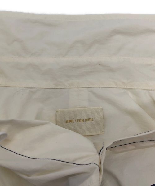 Aime Leon Dore（エメ レオン ドレ）Aime Leon Dore (エメレオンドレ) ロゴプリントナイロンシャツ ネイビー×ホワイト サイズ:Mの古着・服飾アイテム