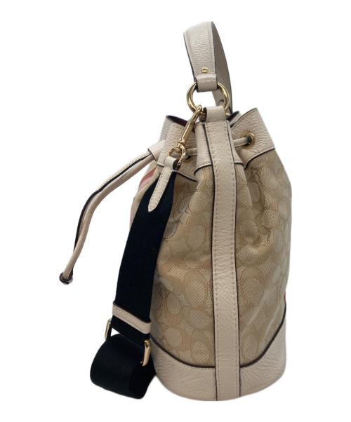 COACH（コーチ）COACH (コーチ) デンプシー ドローストリング バケット バッグ アイボリーの古着・服飾アイテム