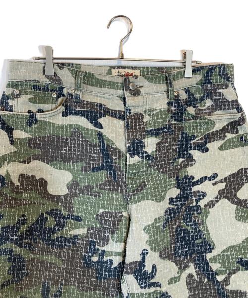 stussy（ステューシー）stussy (ステューシー) BIG OL' JEAN CAMO CANVAS NEEDLE PUNCH グリーン サイズ:SIZE 34の古着・服飾アイテム