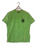 stussyステューシー）の古着「サーフマン半袖Tシャツ」｜グリーン
