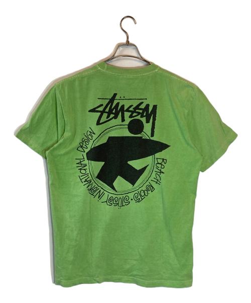 stussy（ステューシー）stussy (ステューシー) サーフマン半袖Tシャツ グリーン サイズ:Lの古着・服飾アイテム
