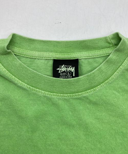 stussy（ステューシー）stussy (ステューシー) サーフマン半袖Tシャツ グリーン サイズ:Lの古着・服飾アイテム