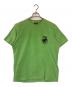 stussy（ステューシー）の古着「サーフマン半袖Tシャツ」｜グリーン