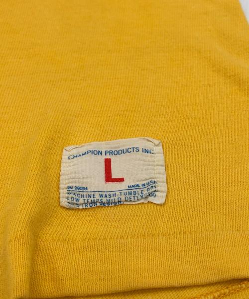 Champion（チャンピオン）Champion (チャンピオン) 両面プリントフットボールTシャツ イエロー サイズ:LARGEの古着・服飾アイテム