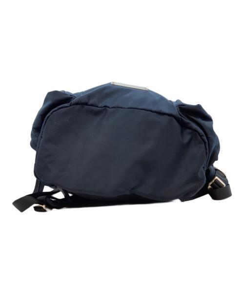 UNDERCOVER（アンダーカバー）UNDERCOVER (アンダーカバー) メタルプレートナイロンリュック ネイビーの古着・服飾アイテム
