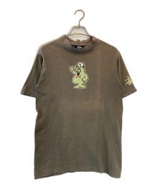 stussy（ステューシー）の古着「Mr.blob プリントTシャツ」｜ブラウン