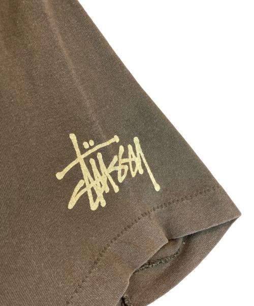 stussy（ステューシー）stussy (ステューシー) Mr.blob プリントTシャツ ブラウン サイズ:Sの古着・服飾アイテム