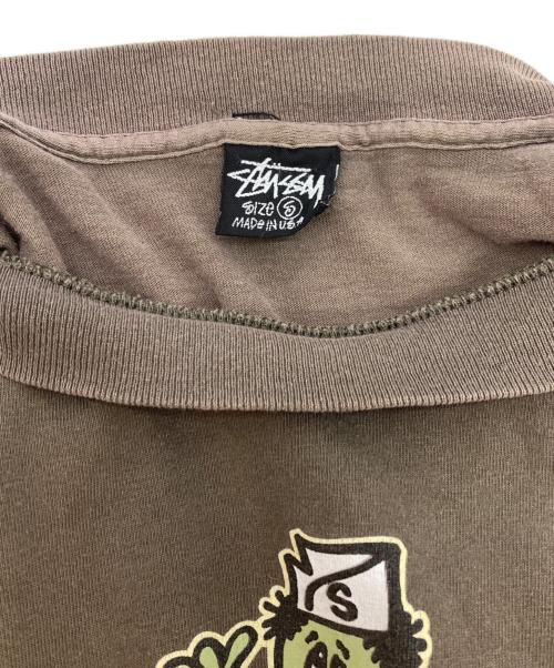 stussy（ステューシー）stussy (ステューシー) Mr.blob プリントTシャツ ブラウン サイズ:Sの古着・服飾アイテム