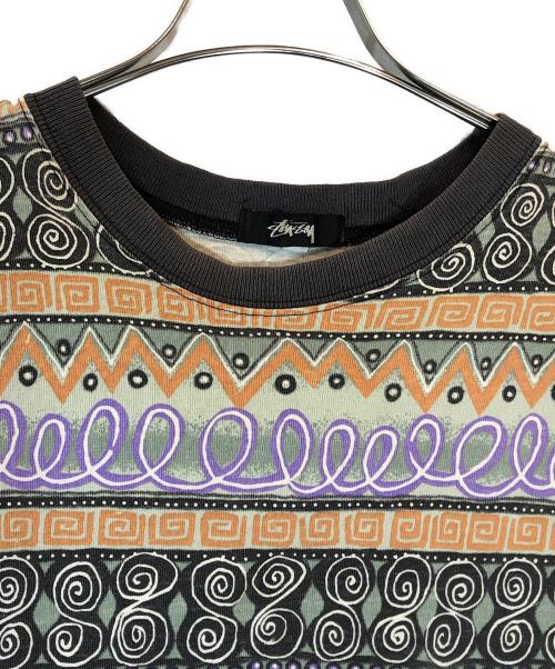 stussy（ステューシー）stussy (ステューシー) TOMTOM柄カットソー ブラック×パープル×オレンジ サイズ:XLの古着・服飾アイテム