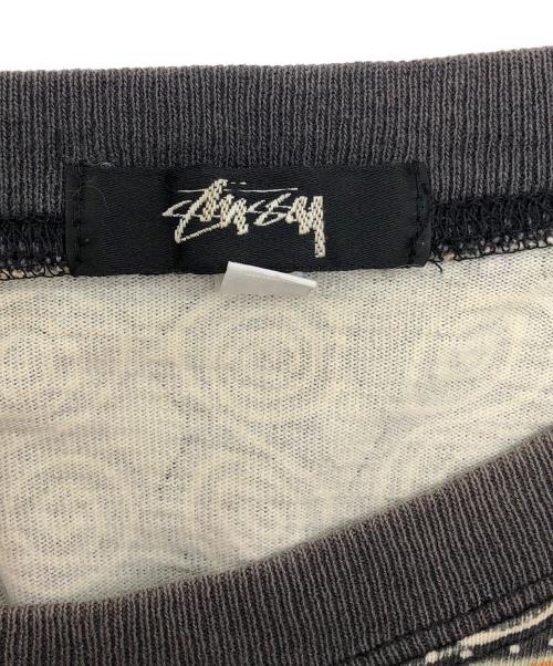 stussy（ステューシー）stussy (ステューシー) TOMTOM柄カットソー ブラック×パープル×オレンジ サイズ:XLの古着・服飾アイテム