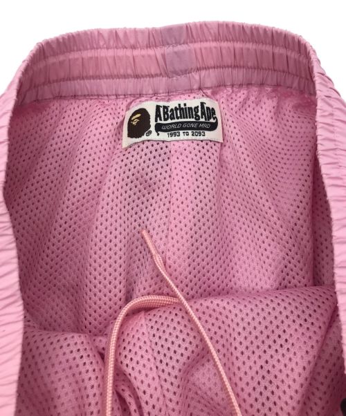 A BATHING APE（アベイシングエイプ）A BATHING APE (アベイシングエイプ) APE HEAD ONE POINT TRACK PANTS L ピンク サイズ:XSの古着・服飾アイテム