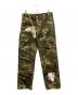 NOMARHYTHM TEXTILE（ノーマリズムテキスタイル）の古着「Sign Print Work Pants camo」｜グリーン