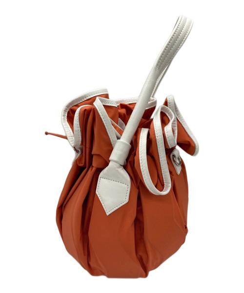 ISSEY MIYAKE（イッセイミヤケ）ISSEY MIYAKE (イッセイミヤケ) 2WAY巾着バッグ オレンジの古着・服飾アイテム