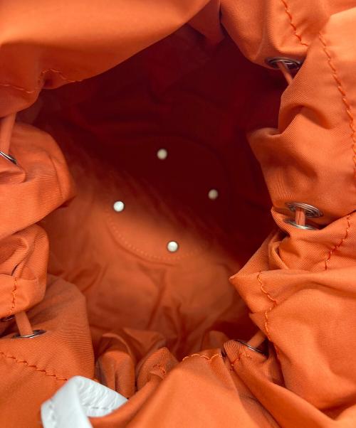 ISSEY MIYAKE（イッセイミヤケ）ISSEY MIYAKE (イッセイミヤケ) 2WAY巾着バッグ オレンジの古着・服飾アイテム