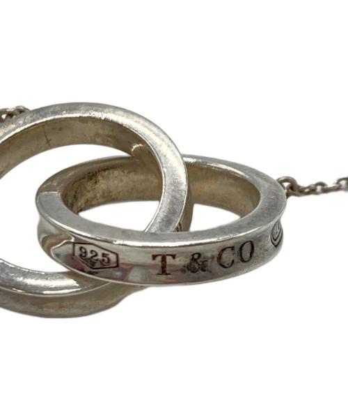TIFFANY & Co.（ティファニー アンド コー）Tiffany & Co. (ティファニー) インターロッキングネックレス シルバーの古着・服飾アイテム