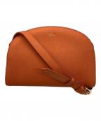 A.P.C.アーペーセー）の古着「ハーフムーンバッグ」｜オレンジ