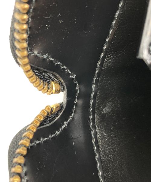 COMME des GARCONS（コムデギャルソン）COMME des GARCONS (コムデギャルソン) ドットエンボス2つ折り財布 ブラックの古着・服飾アイテム
