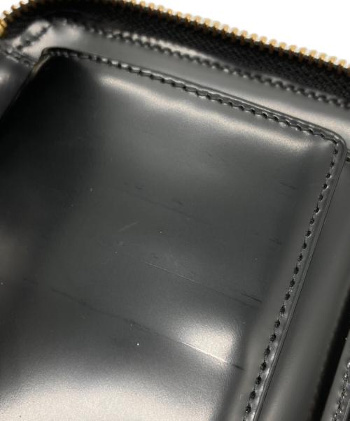 COMME des GARCONS（コムデギャルソン）COMME des GARCONS (コムデギャルソン) ドットエンボス2つ折り財布 ブラックの古着・服飾アイテム