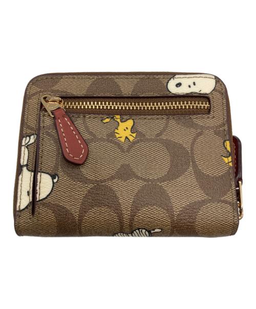 COACH（コーチ）COACH (コーチ) PEANUTS (ピーナッツ) 2つ折り財布 ブラウンの古着・服飾アイテム