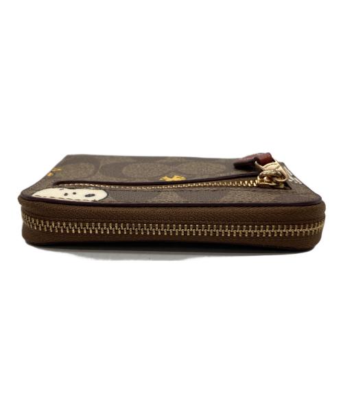 COACH（コーチ）COACH (コーチ) PEANUTS (ピーナッツ) 2つ折り財布 ブラウンの古着・服飾アイテム