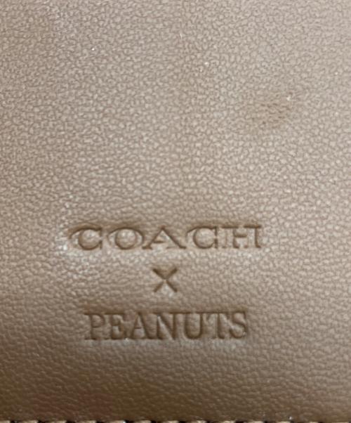 COACH（コーチ）COACH (コーチ) PEANUTS (ピーナッツ) 2つ折り財布 ブラウンの古着・服飾アイテム