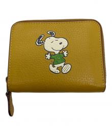 COACH×PEANUTS（コーチ×ピーナッツ）の古着「2つ折り財布」｜イエロー
