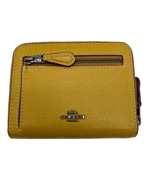 COACH（コーチ）COACH (コーチ) PEANUTS (ピーナッツ) 2つ折り財布 イエローの古着・服飾アイテム