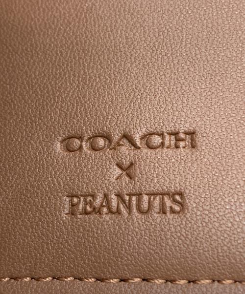COACH（コーチ）COACH (コーチ) PEANUTS (ピーナッツ) 2つ折り財布 イエローの古着・服飾アイテム