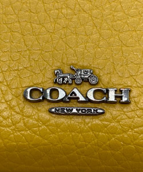 COACH（コーチ）COACH (コーチ) PEANUTS (ピーナッツ) 2つ折り財布 イエローの古着・服飾アイテム