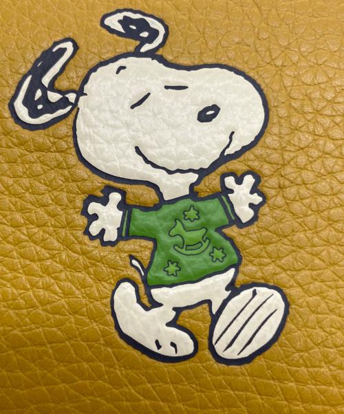 COACH（コーチ）COACH (コーチ) PEANUTS (ピーナッツ) 2つ折り財布 イエローの古着・服飾アイテム