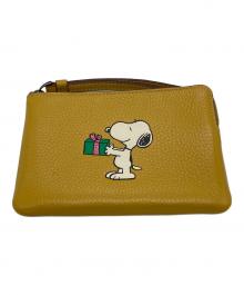 COACH×PEANUTS（コーチ×ピーナッツ）の古着「スヌーピーコラボ ポーチ」｜イエロー