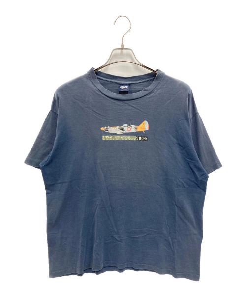 stussy（ステューシー）stussy (ステューシー) INTERNATIONAL SQUADRON プリントTシャツ ネイビー サイズ:XLの古着・服飾アイテム
