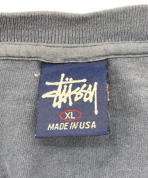 stussy（ステューシー）stussy (ステューシー) INTERNATIONAL SQUADRON プリントTシャツ ネイビー サイズ:XLの古着・服飾アイテム
