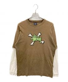 stussy（ステューシー）の古着「クロスボーンプリントレイヤードカットソー」｜ブラウン×ホワイト