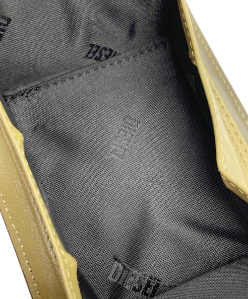 DIESEL（ディーゼル）DIESEL (ディーゼル) 2つ折り財布 グリーンの古着・服飾アイテム