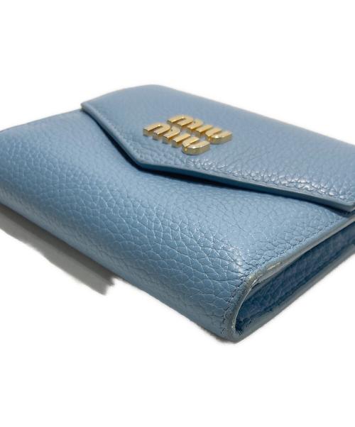 MIU MIU（ミュウミュウ）MIU MIU (ミュウミュウ) ヴィッテロダイノレザーフラップ付折り財布 ブラックの古着・服飾アイテム