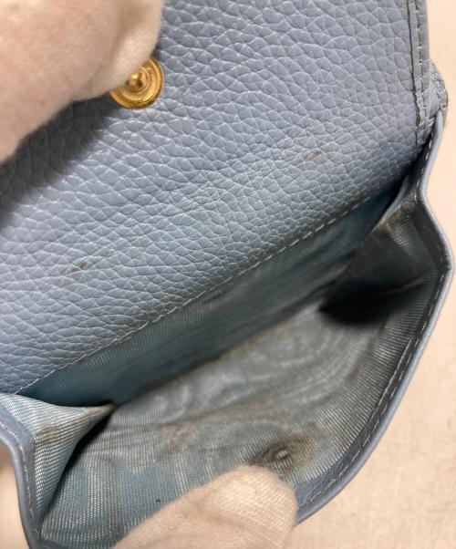 MIU MIU（ミュウミュウ）MIU MIU (ミュウミュウ) ヴィッテロダイノレザーフラップ付折り財布 ブラックの古着・服飾アイテム