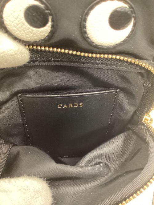 ANYA HINDMARCH（アニヤ・ハインドマーチ）ANYA HINDMARCH (アニヤハインドマーチ) アイズ エッセンシャルズ クロスボディバッグ / Eyes Essentials Crossobody Bag ブラックの古着・服飾アイテム