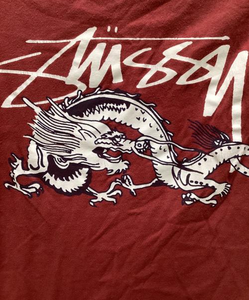 stussy（ステューシー）stussy (ステューシー) ドラゴンプリントTシャツ ブラウン サイズ:Sの古着・服飾アイテム