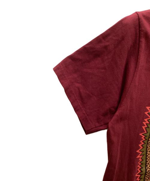 stussy（ステューシー）stussy (ステューシー) トライバルマスクプリントTシャツ パープル サイズ:Sの古着・服飾アイテム