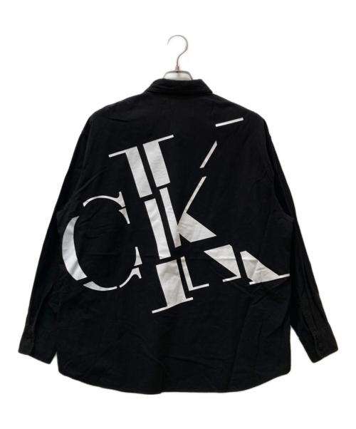 Calvin Klein Jeans（カルバンクラインジーンズ）Calvin Klein Jeans (カルバンクラインジーンズ) バックスキャッター モノグラムシャツ ブラック サイズ:Mの古着・服飾アイテム