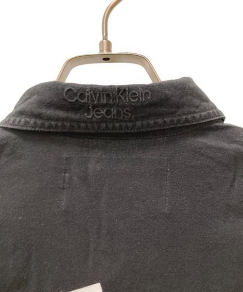 Calvin Klein Jeans（カルバンクラインジーンズ）Calvin Klein Jeans (カルバンクラインジーンズ) バックスキャッター モノグラムシャツ ブラック サイズ:Mの古着・服飾アイテム