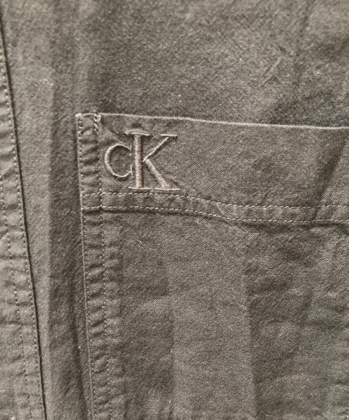Calvin Klein Jeans（カルバンクラインジーンズ）Calvin Klein Jeans (カルバンクラインジーンズ) バックスキャッター モノグラムシャツ ブラック サイズ:Mの古着・服飾アイテム