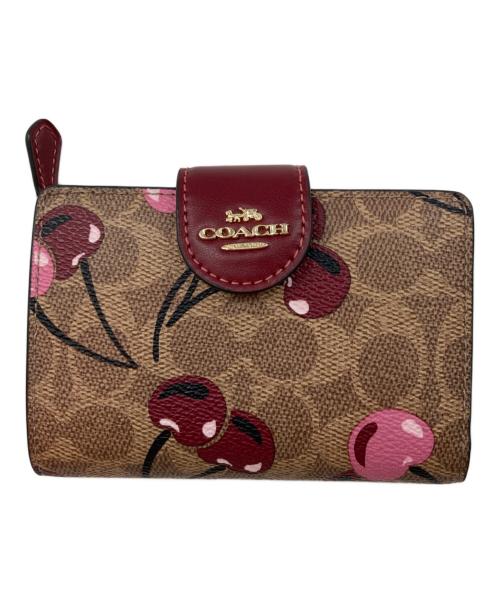 COACH（コーチ）COACH (コーチ) チェリー柄二つ折り財布 ベージュの古着・服飾アイテム