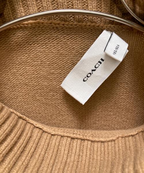 COACH（コーチ）COACH (コーチ) オーバーサイズド ホース アンド キャリッジ タートルネック ベージュ サイズ:Mの古着・服飾アイテム