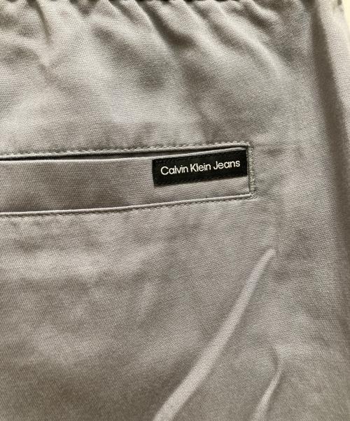 Calvin Klein Jeans（カルバンクラインジーンズ）Calvin Klein Jeans (カルバンクラインジーンズ) ロゴ ウーブン ハーフパンツ ブルー サイズ:Sの古着・服飾アイテム