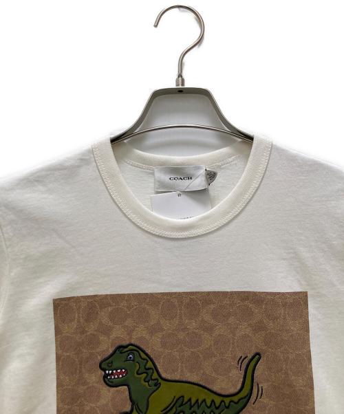 COACH（コーチ）COACH (コーチ) レキシ―プリントTシャツ ホワイト サイズ:XS 未使用品の古着・服飾アイテム