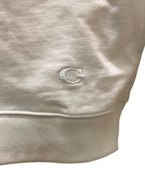 COACH（コーチ）COACH (コーチ) Disney (ディズニー) コラボシグネチャープルオーバーパーカー アイボリー サイズ:Ⅼの古着・服飾アイテム